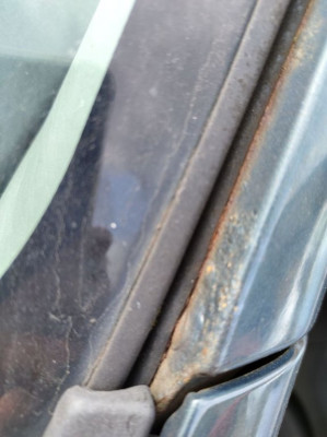 Check the inside of the windscreen pillar